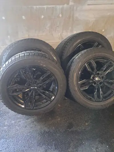 Black custom rims and very good winter tires. Only used for couple of winters and stored at dealersh...