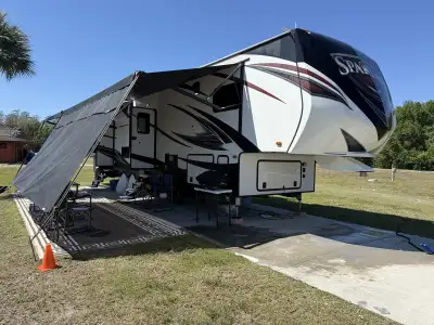 Spartan 1135 Fifth Wheel Toy Hauler. King Bed. 11’ garage with Moryde ramp rail system. Double bunk...