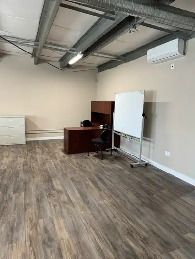 Furnished upstairs office space in the industrial area. Two corner desks, one with a stand-up sectio...