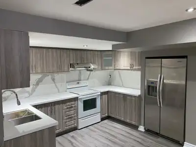 This spacious and modern 3-bedroom basement apartment features a fully renovated kitchen with stainl...