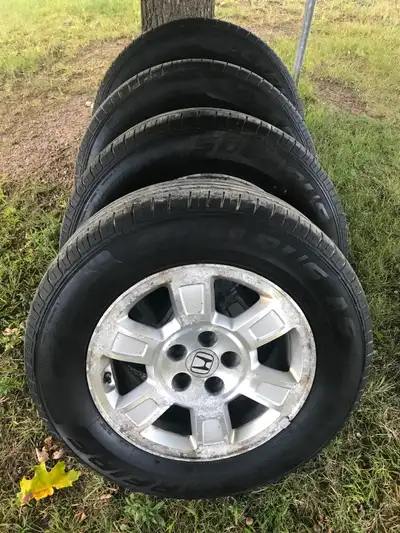 Honda Ridgeline Tires on Rims 245/65R17 with a bolt pattern of 5X120mm. These are Starfire Solarus A...