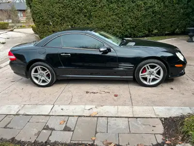 A luxurious convertible with only 192,000 KMs, 5.5 Litre engine, Black with Beige leather interior....
