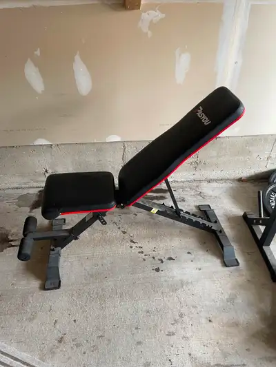 Adjustable workout bench. 2 decline angles, flat, a few inclines and almost straight up. Good paddin...
