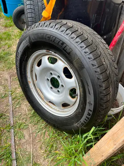 255/75 R 17 Michelin tires quantity of 4. 30% wear. , with hubcaps and Six bolt rims and nuts for a...